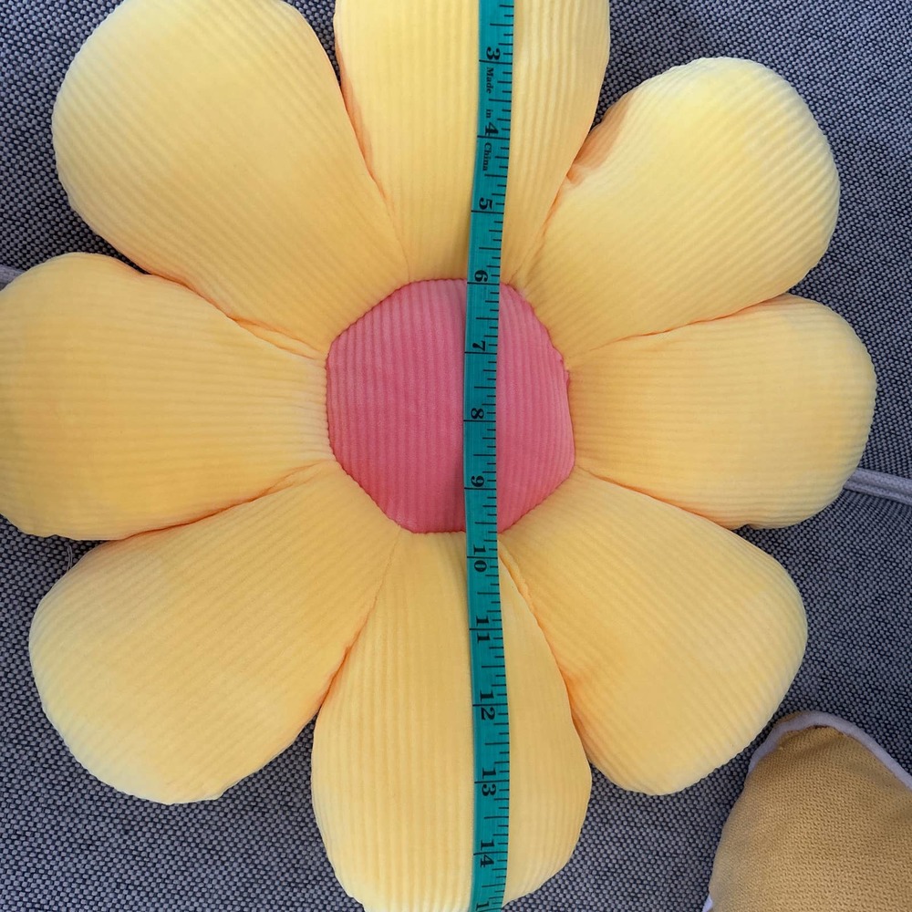 Dorm decor pillows yellow petals peach center so plush.